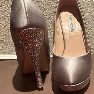 One pair of slightly used silver dress heels, size 6M!
